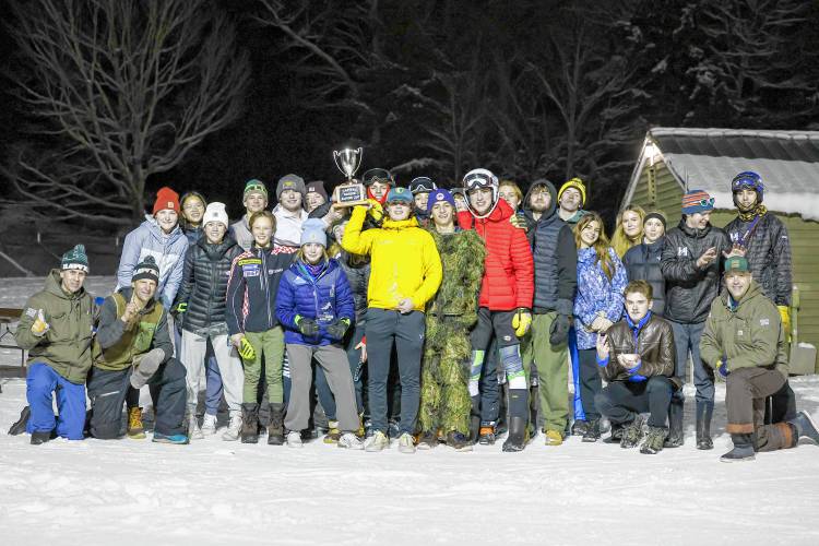 The Hopkinton Alpine ski team celebrates its victory at the 16th annual Capital Cup at Proctor Academy on Monday. The Hawks won the event, which combines both boys’ and girls’ team scores, for the second consecutive year.