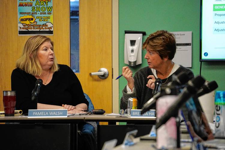 Board President Pamela Walsh, left, and Vice President Brenda Hastings discuss potential budget amendments.  