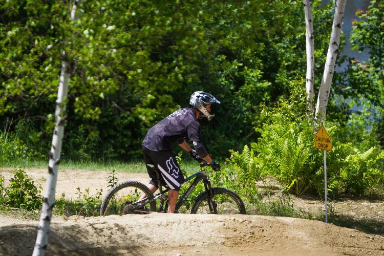 Visitors enjoy the trails at Highland Mountain Bike Park in Northfield on Saturday, June 6, 2015.