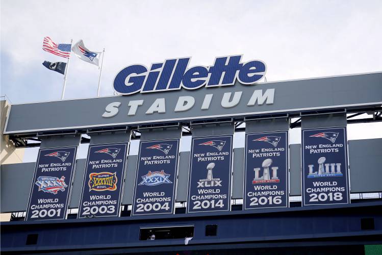 FILE - Championship banners hang at Gillette Stadium before an NFL football game in Foxborough, Mass on Sept. 22, 2019. ne of two Rhode Island men charged with assault and battery and disorderly conduct in connection with the death of a fan at a New England Patriots game pleaded not guilty Friday, Jan. 19, 2024. (Winslow Townson/AP Images for Panini via AP, File)