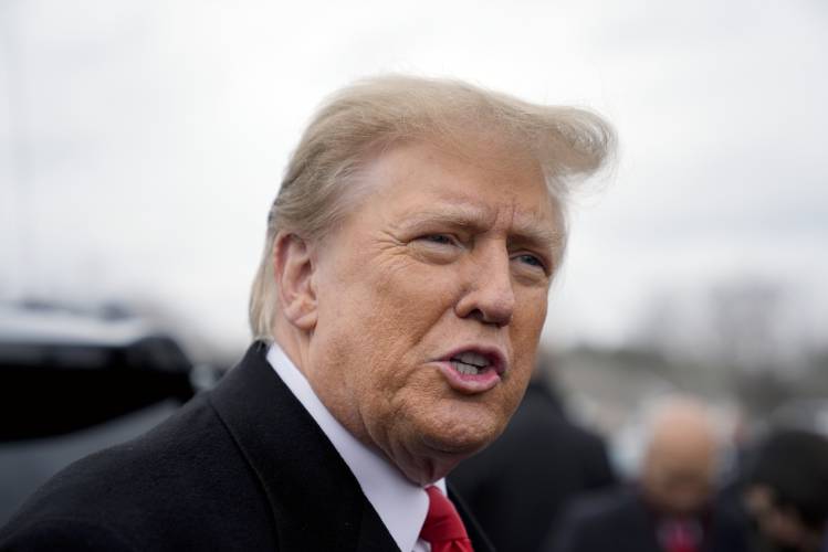 Republican presidential candidate former President Donald Trump addresses members of the press during a campaign stop in Londonderry, N.H., Tuesday, Jan. 23, 2024. (AP Photo/Matt Rourke)