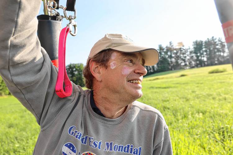Jones lands his balloon in a nearby field.