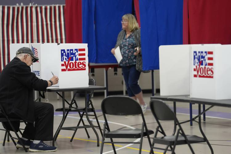 Voters fill out ballots, in a primary election to pick candidates for governor, the U.S. House, and the state Legislature, Tuesday, Sept. 10, in Nashua. Voters fill out ballots, in a primary election to pick candidates for governor, the U.S. House, and the state Legislature, Tuesday, Sept. 10, in Nashua.