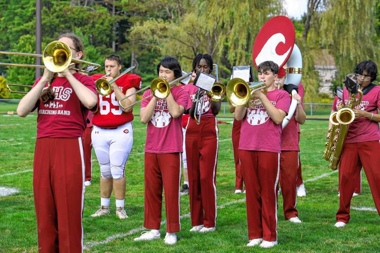 Senior football lineman, Jacob Breau, plays the Trombone in his full pads at half-time