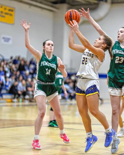 Bow’s Peyton Vaughn goes up for a shot while being closely guarded by Pembroke’s Hailey Steinmetz (11) and Kaitlin Arenella (23) on Tuesday night at Bow High School. Vaughn scored 27 points and had eight rebounds to lead Bow to a narrow 57-53 win.