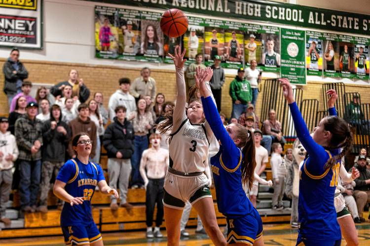 Kearsarge’s Ava Shapiro (right center) guards Monadnock's Shaylee Branon (3) during the Division III girls' basketball preliminary round game on Wednesday in Swanzey. Monadnock defeated defending champion Kearsarge, 48-45, in double overtime.