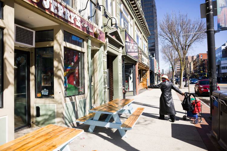 Deborah Eckland looks over at the spot on Elm Street in Manchester that she used to hang out when she was homeless.