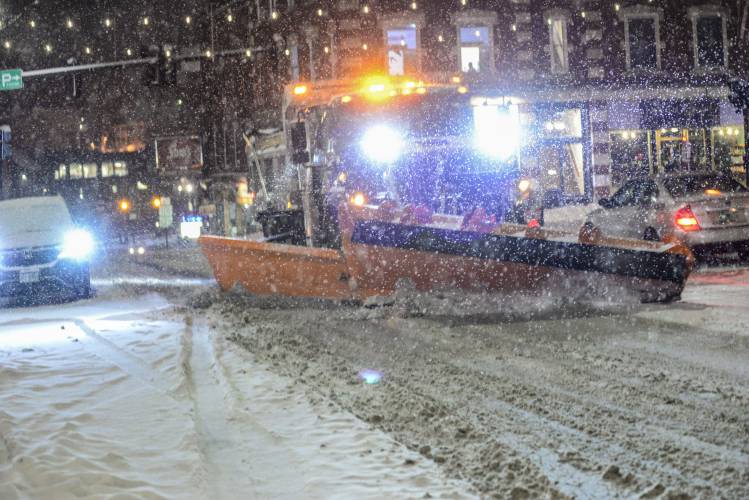 A plow from the Brattleboro, Vt., Public Works Department removes snow on Main Street on Tuesday, Jan. 9, 2024. (Kristopher Radder/The Brattleboro Reformer via AP)