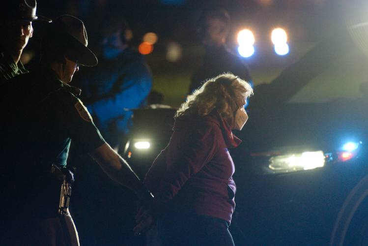 New Hampshire State Police arrest Laura Simon, of Hartford, who joined students protesting the Israel-Hamas War in an encampment on the Dartmouth College Green in Hanover, N.H., on Wednesday, May 1, 2024. (Valley News - James M. Patterson) Copyright Valley News. May not be reprinted or used online without permission. Send requests to permission@vnews.com.