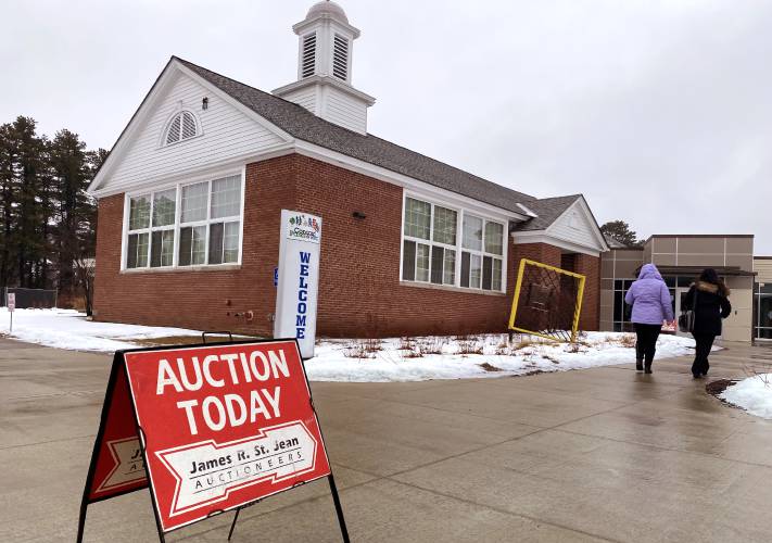 The auction sign outside the Concord Community Center before the auction to sell off properites on Friday, January 26, 2024.