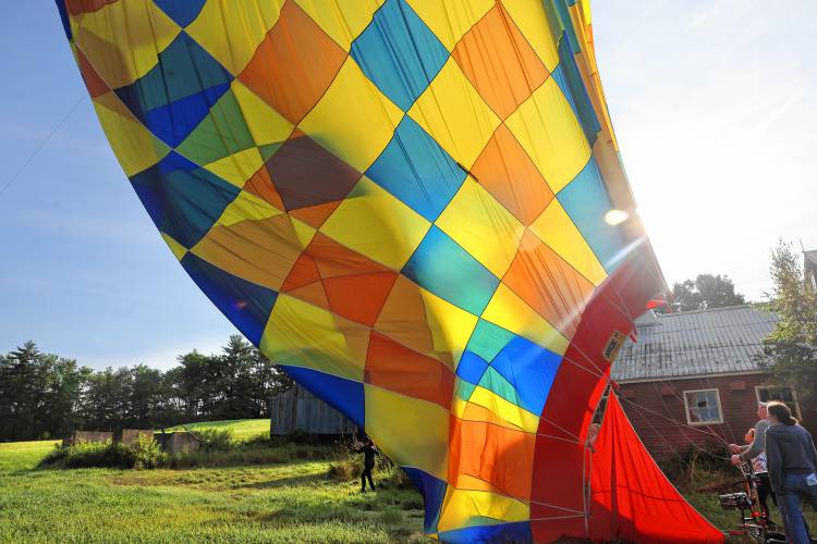 Jones lands his balloon in a nearby field.