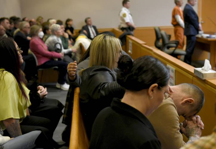 YDC victim Michael Gilpatrick puts his head in his hands as the judge sentences Bradley Asbury, 70, to the maximum sentence at Hillsborough County Superior Court in Manchester, N.H., Monday, Jan. 27, 2025. (David Lane/Union Leader via AP, Pool)