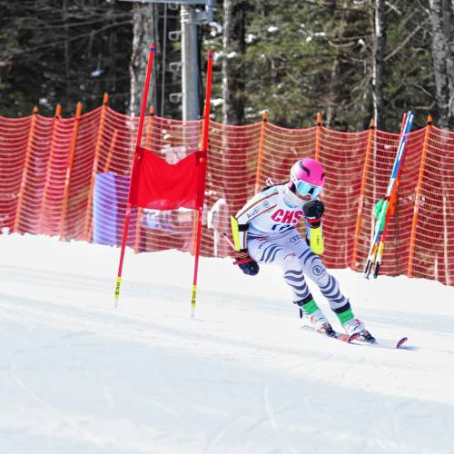 With her left arm in a sling and skiing with just one pole, Concord High senior Ellie Worster makes her way through the giant slalom course on Tuesday at Pats Peak during the Division I girls’ Alpine skiing championships. Worster suffered a shoulder injury during her second giant slalom run, but pushed through to finish second in both the GS and slalom.