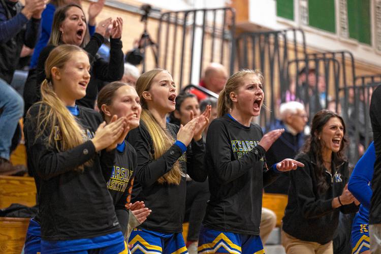 The Kearsarge bench reacts to a basket during a Division III girls’ basketball preliminary round game on Wednesday in Swanzey. Monadnock defeated defending champion Kearsarge, 48-45, in double overtime.