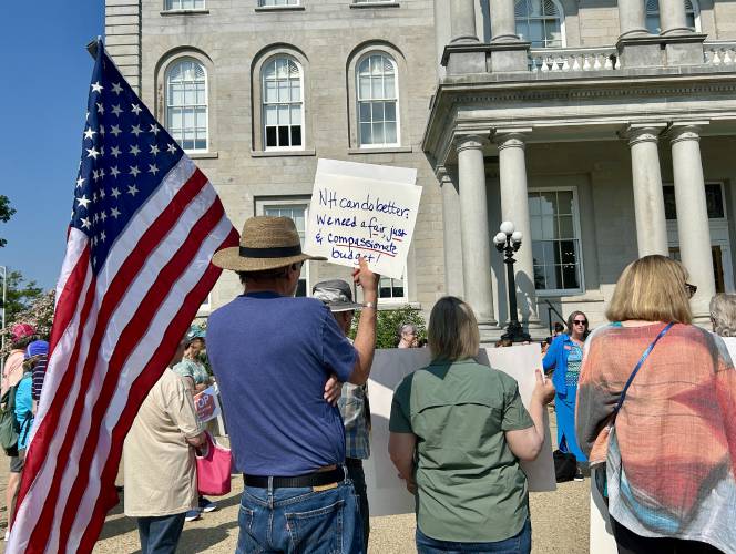 Organizers rallied outside the State House on Thursday, June 5, 2025, advocating for the state Senate to include more funding for Medicaid and other social services in its version of the budget.