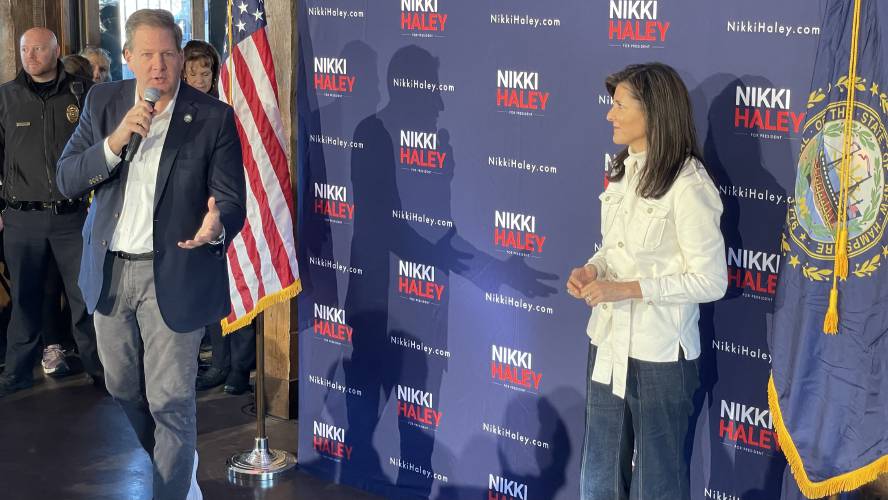 Gov. Chris Sununu speaks during an election event in Hooksett alongside 2024 presidential hopeful Nikki Haley.