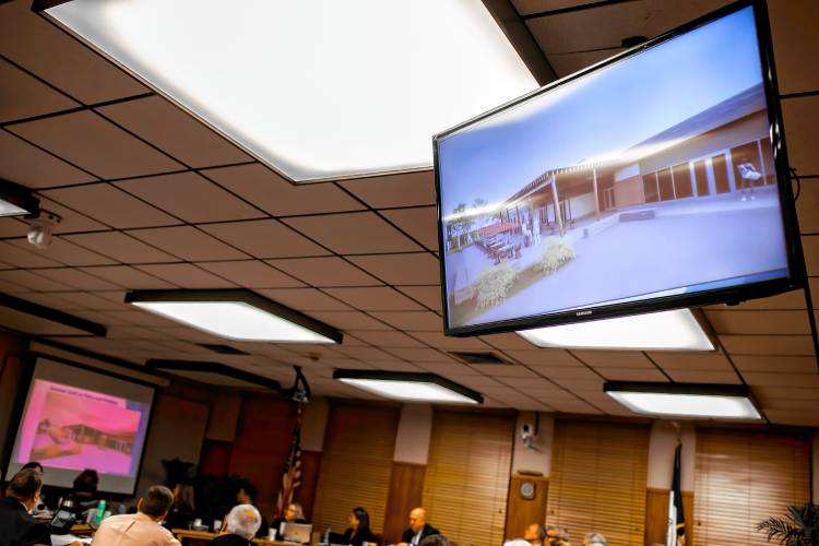 The new proposed Beaver Meadow Clubhouse is shown on monitors at the city council meeting on Monday night, December 11, 2023.