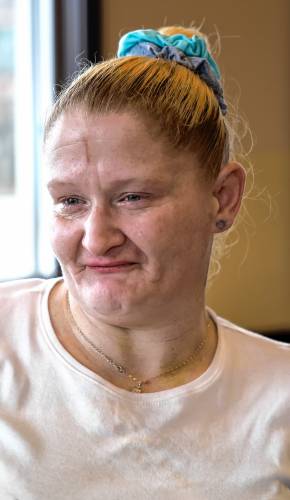 Marjorie Blaisdell holds back tears as she talks about her homeless situation at the South Main Street Dunkin Doughnuts on Tuesday, March 5, 2024.
