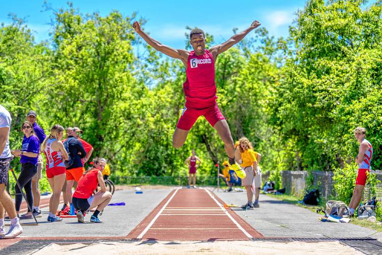 Concord’s Alain Twite competes in the triple jump at the NHIAA Division I track and field championships at Portsmouth High School on Saturday. Twite finished second in the triple jump with a leap of 43 feet, 8 inches, and also finished second in the high jump and long jump to lead the Concord boys to fourth place overall.
