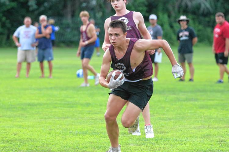 Concord’s Colin Savard runs with the football during a seven-on-seven scrimmage against Manchester West on July 22 at Rundlett Middle School field. The 2024 NHIAA football season officially began on Friday, with Savard and the Crimson Tide facing no major changes to their Division I routine.
