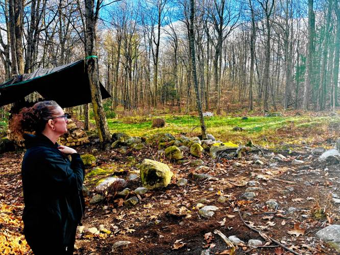 Musician Kate Schimke looks over the hillside above her Brookwood home. 