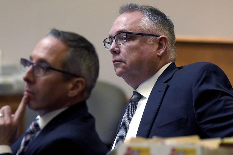 Stephen Murphy, right, and his attorney Charles Keefe watch as the judge gives the jury instructions following closing remarks during his trial at Hillsborough County Superior Court in Manchester, N.H., on Tuesday.