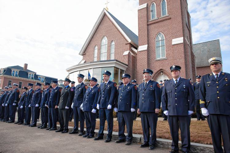 Firefighters from around the state line up outside Christ the King Parish in Concord as they wait for the hearse carrying Concord firefighter Christopher âCJâ Girard on Thursday, March 13, 2025.
