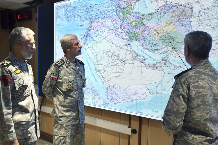 In this photo released by Iranian army press service, Iran’s army commander-in-chief Gen. Amir Hatami, center, Admiral Mahmoud Mousavi, right, and Admiral Habibollah Sayyari attend a meeting in Zolfaghar central headquarters, Iran. In this photo released by Iranian army press service, Iran’s army commander-in-chief Gen. Amir Hatami, center, Admiral Mahmoud Mousavi, right, and Admiral Habibollah Sayyari attend a meeting in Zolfaghar central headquarters, Iran.