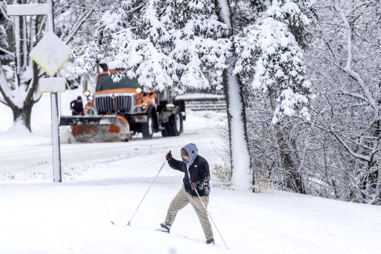 Eli Foxley uses cross-country skis at Elmwood Park in Omaha, Neb., on Tuesday, Jan. 9, 2024. (Chris Machian/Omaha World-Herald via AP)