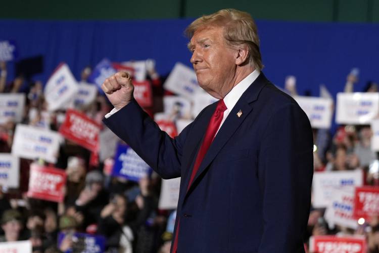 FILE - Republican presidential candidate former President Donald Trump arrives at a campaign rally, March 2, 2024, in Greensboro, N.C. The Supreme Court has restored Donald Trump to 2024 presidential primary ballots, rejecting state attempts to hold the Republican former president accountable for the Capitol riot. The justices ruled a day before the Super Tuesday primaries that states cannot invoke a post-Civil War constitutional provision to keep presidential candidates from...