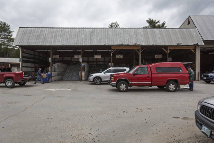 Residents separate recyclables at the Hopkinton/Webster Transfer Station in Hopkinton on Friday, April 1, 2016. (ELIZABETH FRANTZ / Monitor staff)