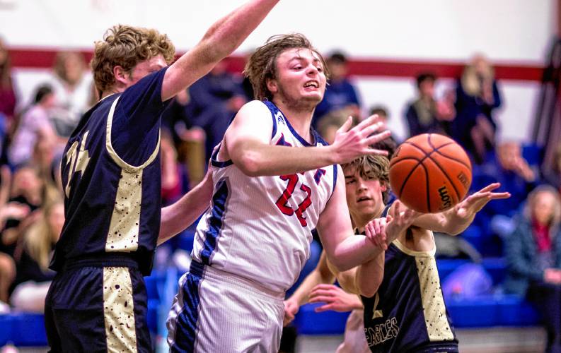 Pittsfield forward Elias Gates gets surrounded by Portsmouth Christian Academy players during the first half on Tuesday night.