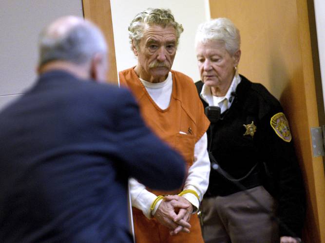 Bradley Asbury, 70, gets escorted into the courtroom for his sentencing hearing at Hillsborough County Superior Court in Manchester, N.H., Monday, Jan. 27, 2025. (David Lane/Union Leader via AP, Pool)