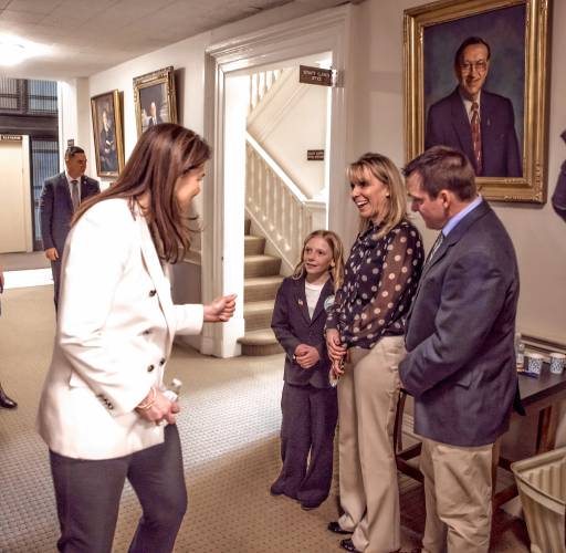 New Hampshire Governor Kelly Ayotte congratulates NH Kid Governor Jade Adams before she was introduced with her parents to the full Representative Hall on Tuesday, January 28, 2025. Adams is fifth grade student at Wells Memorial School in Harrisville.