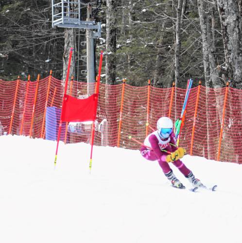 Concord freshman Sadie Pelletier carves her way down the course during the Division I girls’ Alpine ski championships on Monday at Pats Peak. Pelletier finished 40th in the slalom to score for the Tide.
