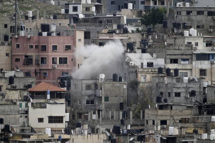 Smoke rises from an ongoing Israeli military operation in the West Bank Nur Shams refugee camp on Feb. 12. Smoke rises from an ongoing Israeli military operation in the West Bank Nur Shams refugee camp on Feb. 12.