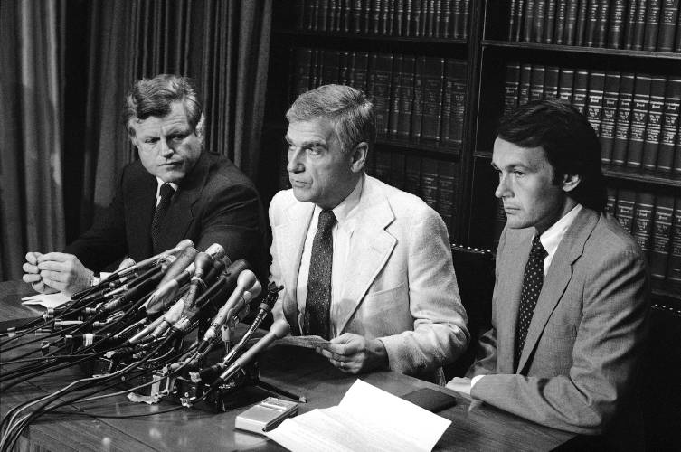 Sen. Edward M. Kennedy, D-Mass, left Sen. Mark O. Hatfield, R-Ore., center and Rep. Edward Markey, D-Mass, face reporters on Aug. 7, 1982 on Capitol Hill, Washington the day after the house voted 204-202 to defeat a nuclear weapons freeze resolution. 