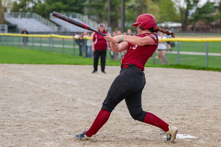 Kiley Taylor connects for a double in the eighth inning to lead the Concord High School softball team to a 7-6 walk-off victory over Dover on Friday at Memorial Field. Her double brought home her older sister Maggie for the game-winning run. 