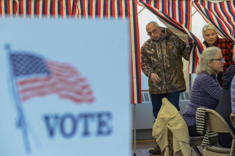 Rene Fish of Chesterfield, N.H. steps out of the voting booth in the New Hampshire primary on Tuesday, Jan. 23, 2024. (Kristopher Radder /The Brattleboro Reformer via AP)