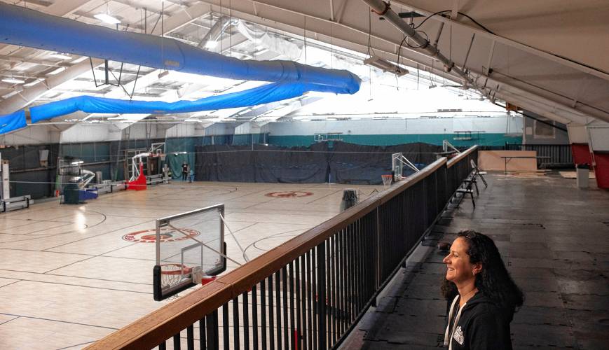 Capital City Sports and Fitness manager Frances Plunkett overlooks the new gym at the facility on Friday, January 19, 2024. The former tennis courts now has new floors for basketball and other indoor activities.