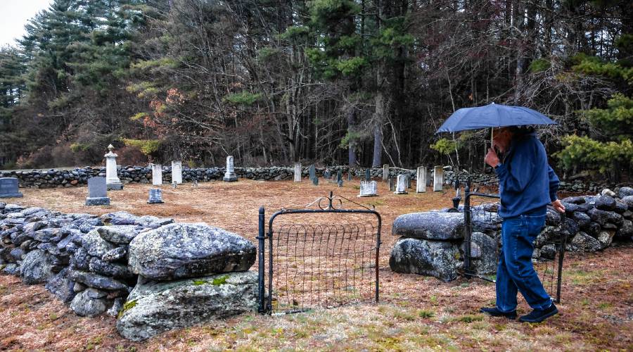 Norm Yeaton enters the private Yeaton cemetery off of Black Hill Road  in Dpsom on Thursday, April 11, 2024. Yeaton has taken on the arduous research project by Yeaton to understand the sheer volume of people in Epsom whose last name was the same as hisâeven when the name was Yeton before they added the âaâ early in the 19th century.