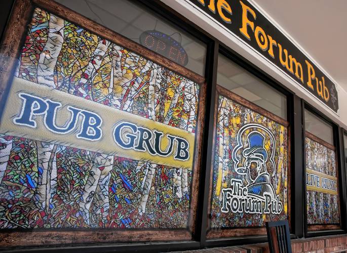 Everything about The Forum Pub has a unique flavor, including the signage out front.