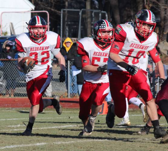 Hillsboro-Deering/Hopkinton running back Colby Quiet (32) follows blockers Damien Figueroa (57) and Dylan Barrett (18) during November 2019 game at Lebanon. The HDH co-op team is now a standalone Hillsboro-Deering High School program for the first time, debuting in NHIAA Division IV this fall.