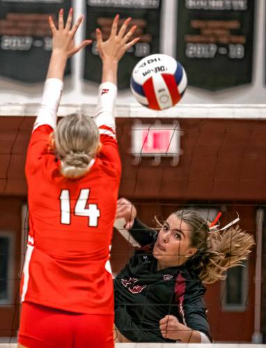 Concord’s Maggie Taylor follows through on a spike against Pinkerton Academy on Monday night.