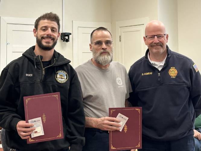 Bruce Maxwell and Duane Reese were recognized by Bow fire chief Dennis Comeau for rescuing the driver of the overturned propane truck on Tuesday, April 15.