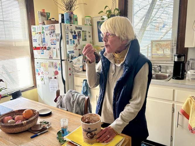 Barbara Filion indulges in her favorite chocolate-flavored ice cream straight from the tub in the comfort of her Portsmouth home.