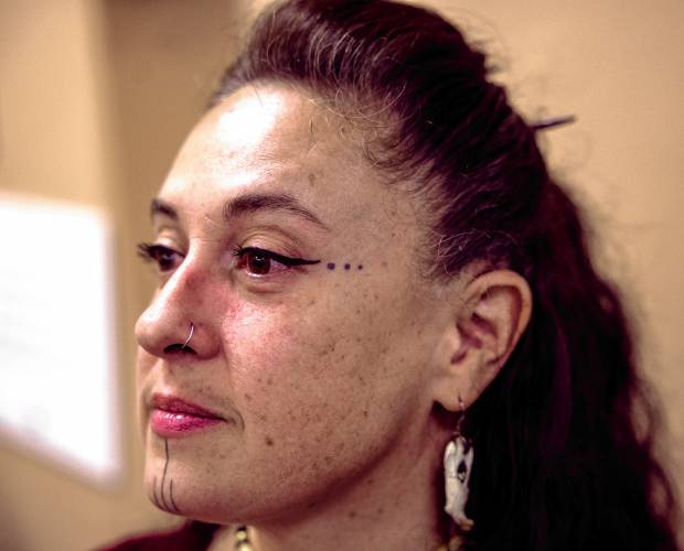 Author Christine Nih’Shaw shows her warrior markings on her eyes and chin after her presentation at the Mt. Kearsarge Indian Museum for Indigenous Peoples' Day on Monday, October 14, 2024. Nih’Shaw has written books for both children and young adults and is a boxer.