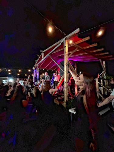 Starsea Deoss, who created the Sad AF Collective a few years back, dances with the crowd at one of her emo nights in Concord.
