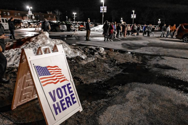 The line for voting before the Merrimack Valley School District meeting went outside into the parking lot on Thursday.
