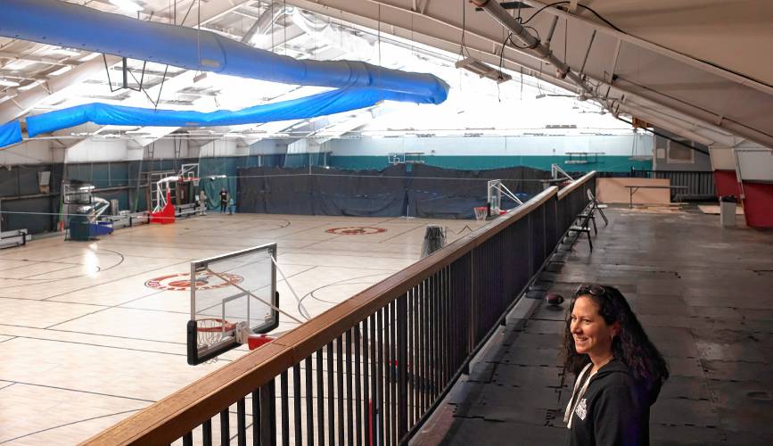 Capital City Sports and Fitness manager Frances Plunkett overlooks the new gym at the facility on Friday. The former tennis courts now has new floors for basketball and other indoor activities.